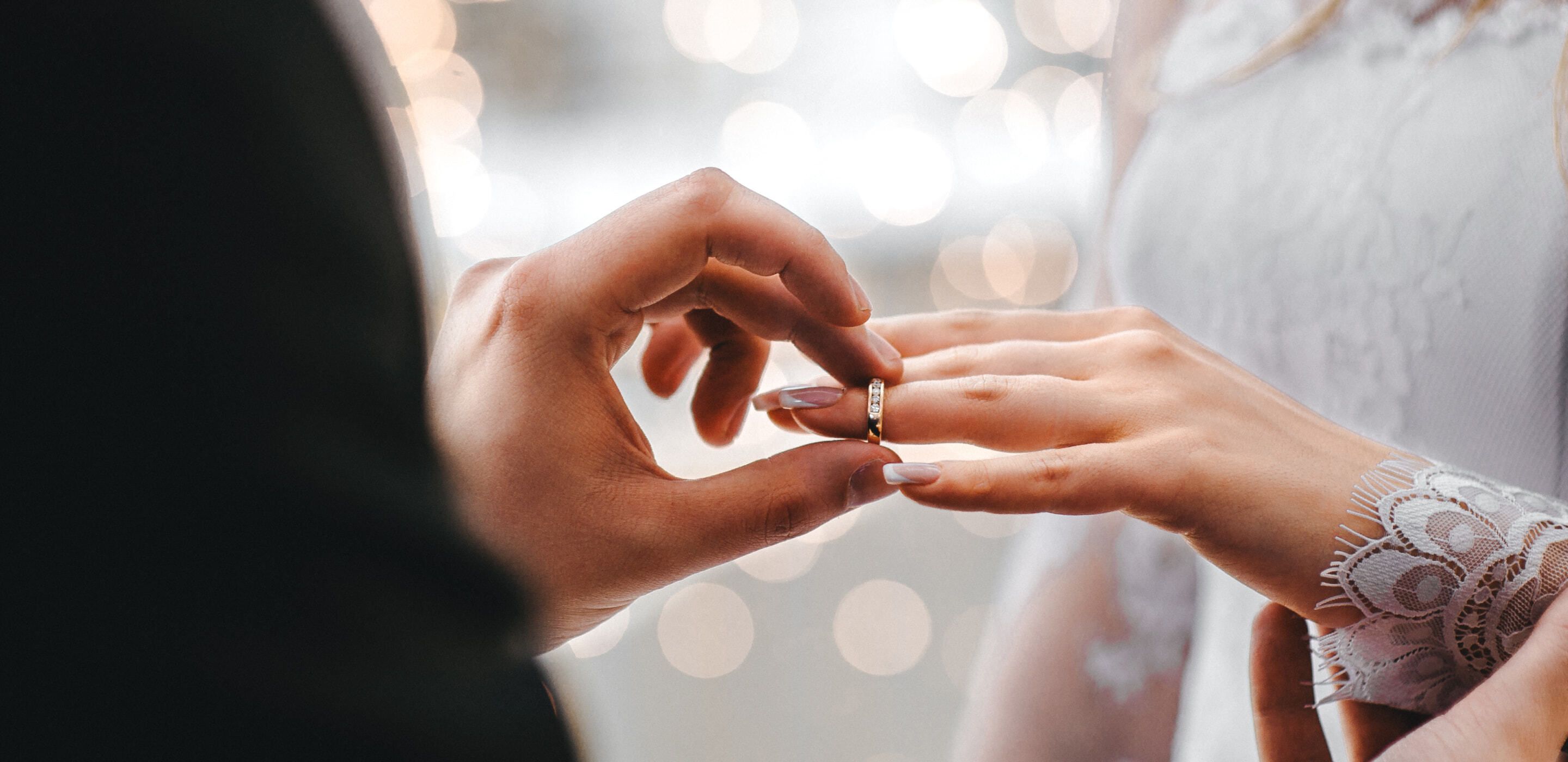 Man putting a ring on finger